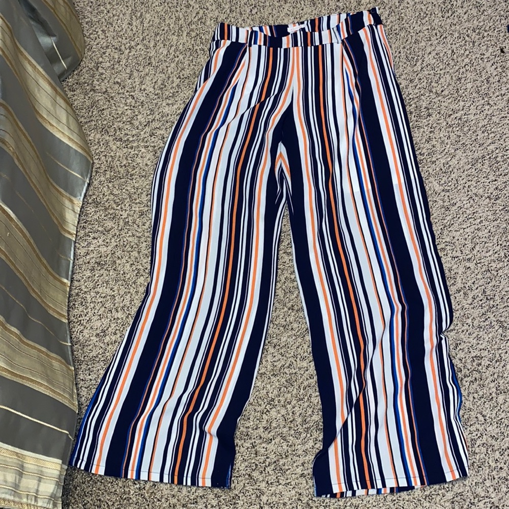 Women’s pants. Flared, striped pants with a tie.